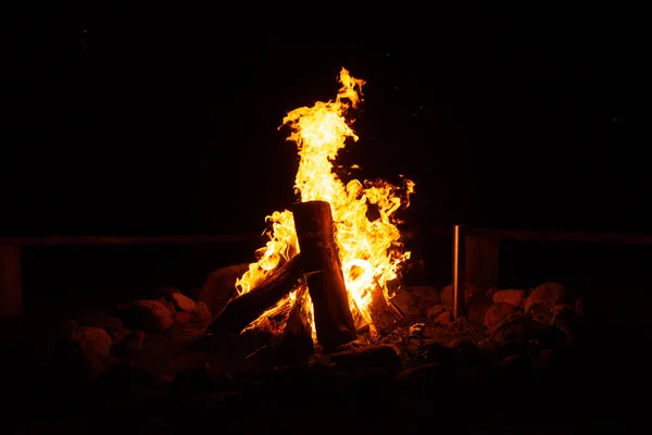 Flames Of Fire And Sparks Isolated On Black Background. Magic Fiery Wallpaper. Abstract Flaming Background. Flying Sparks Background, Closeup View. Bonfire Flaming In The Night. Energy Concept.