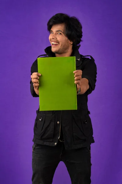Young Happy Man Holding Posing Book Background — Stockfoto