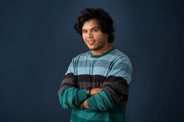 Portrait Happy Indian Young Man Arms Crossed Dark Background — Stockfoto