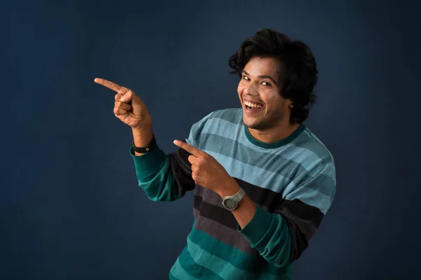 Portrait Successful Cheerful Young Man Pointing Presenting Something Hand Finger — Stockfoto