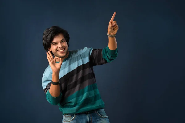 Portrait Successful Cheerful Young Man Pointing Presenting Something Hand Finger — Stockfoto