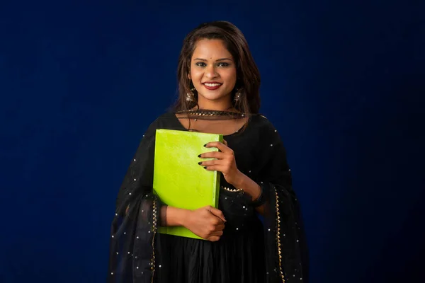 Pretty Young Girl Posing Book Blue Background — Stockfoto