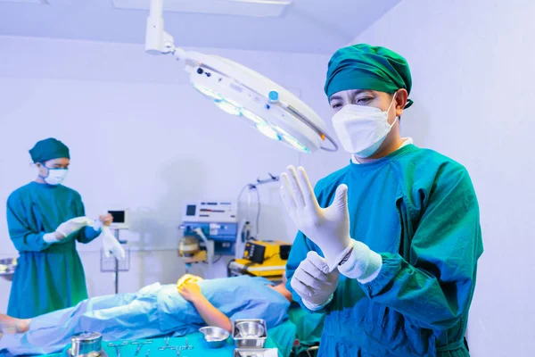 doctor wear surgical gloves in operating room, operation or surgery room in hospital for doctor and patient