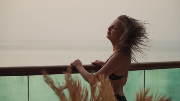 Girl in a swimsuit waving her hair in slow mo — Video