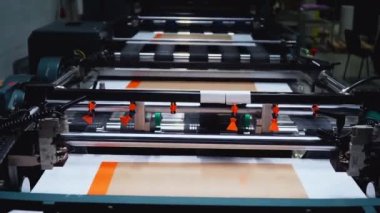 conveyor printing of book covers in production