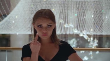 Caucasian girl gestures fuck sign. 