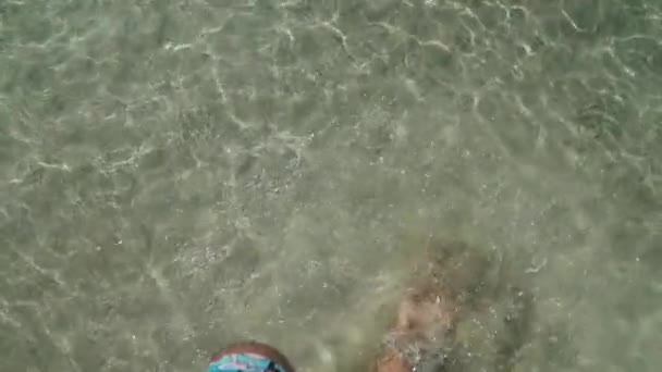 Legs of a young white girl in the water — Stock Video