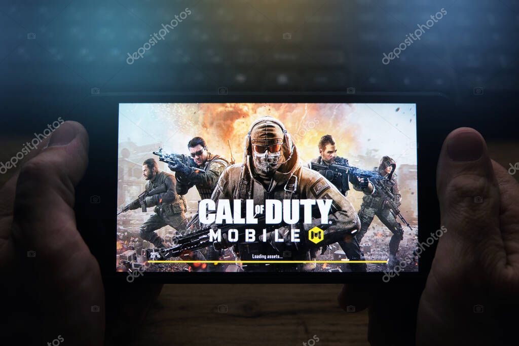 Kostanay, Kazakhstan, November 05, 2021Man holds a mobile phone with a screensaver of the popular Call of Duty game