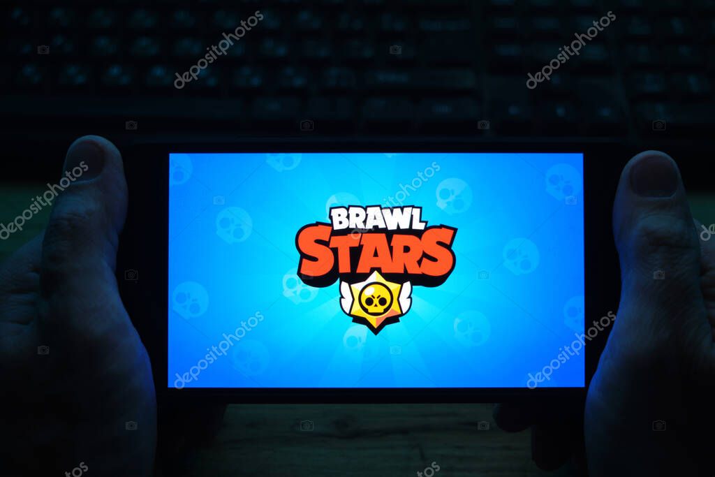 Kostanay, Kazakhstan, November 04, 2021.A man holds a mobile phone with a screensaver of the popular Brawl Stars game
