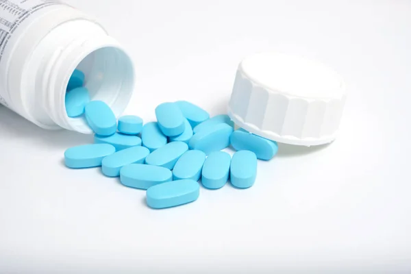 Scattering Blue Pills Bottle White Background — Stock Photo, Image
