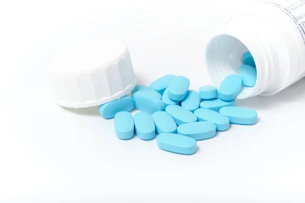 Scattering Blue Pills Bottle White Background — Stock Photo, Image