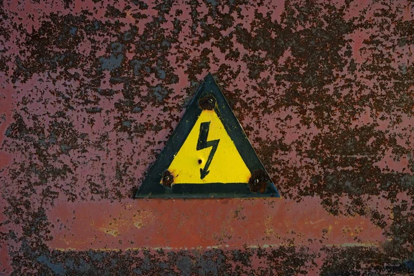 Old Rusty Warning Danger High Voltage Form Lightning Yellow Background — Stock Fotó