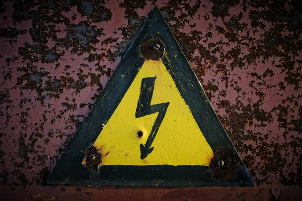 Old Rusty Warning Danger High Voltage Form Lightning Yellow Background — стоковое фото
