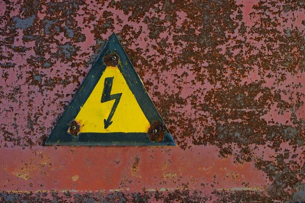 Old Rusty Warning Danger High Voltage Form Lightning Yellow Background — Stockfoto