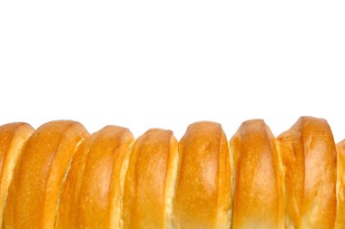 Crust of the loaf is close up on white background.Freshly baked bread