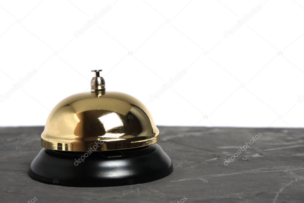 Gilded hotel service bell on a white background, isolate