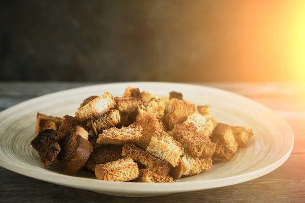 Wooden Plate Fried Breadcrumbs Dark Background Rays Sun Rustic Setting — Stock Photo, Image
