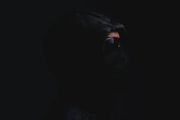 Stylish Man Dark Hoodie Black Glasses Mask Dark Background Hacker — Fotografia de Stock