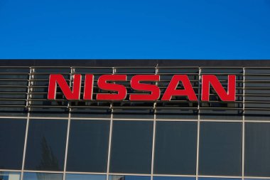 Kazakhstan, Kostanay, May 11, 2022, car dealership, logo on dealership building Japanese manufacturer Nissan