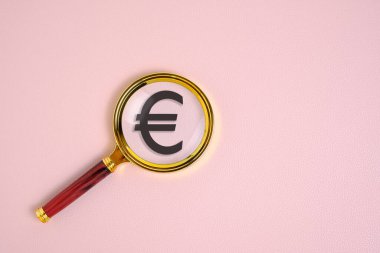 Avro sembolü büyüteç altında, pembe arka planda