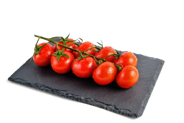 Tomates Cereja Uma Tábua Corte Ardósia Isolar Fundo Branco — Fotografia de Stock