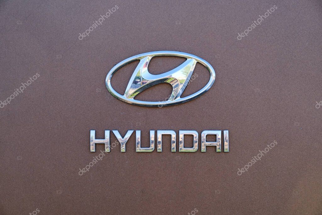Kazakhstan, Kostanay, May 11, 2022, Hyundai logo on a cherry background