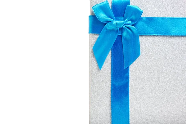 Gift box white background is tied with blue ribbon with bow