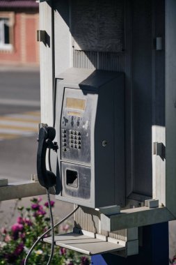 Old street, public push-button payphone.Retro technology