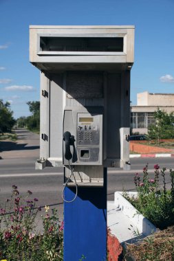 Old street, public push-button payphone.Retro technology