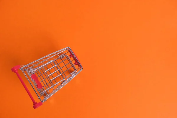 Shopping Cart Orange Background Concept Purchase Budget — Stok fotoğraf