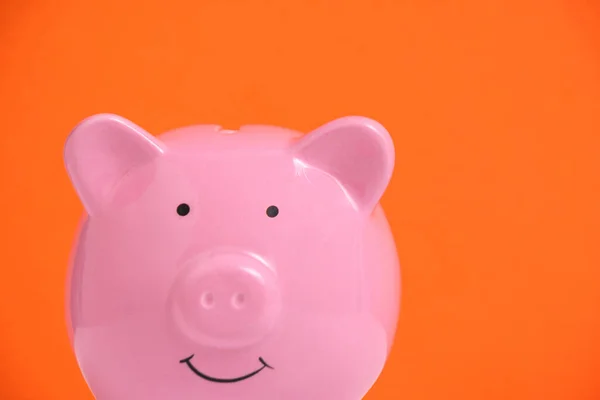 Pink Piggy Bank Orange Background — Fotografia de Stock