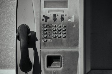 Old street, public push-button payphone.Retro technology