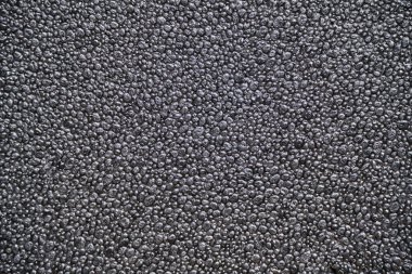 Abstract background, grey foam texture, porous material made up cells that do not communicate with each other