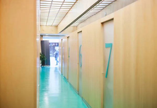 Corridor with massage cabins in a physiotherapy centre