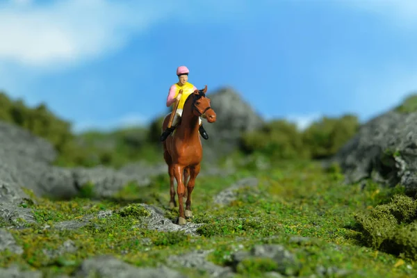 Miniature People Toy Figure Photography Jockey Man Riding Horse Mountain — 스톡 사진