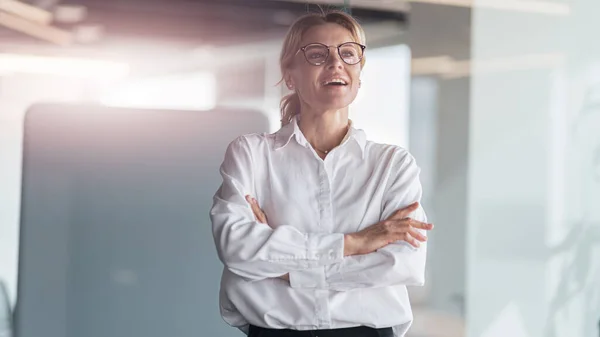 Smiling beautiful business woman working in modern IT office and looks away — Foto de Stock