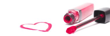 Pink lipstick near drawing heart isolated on white. Concept of beauty and love, woman and valentines day. Banner, copy space.