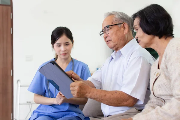 Nursing Home Care concept. The staff explained to the elderly who signed a medical treatment contract, a nursing home service agreement form.