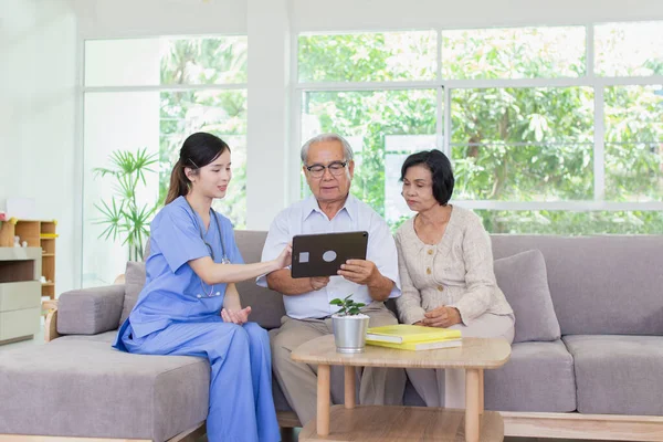 Nursing Home Care concept. The staff explained to the elderly who signed a medical treatment contract, a nursing home service agreement form.