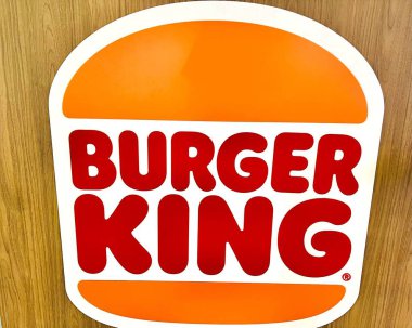 Close up of Burger king logo with wooden background