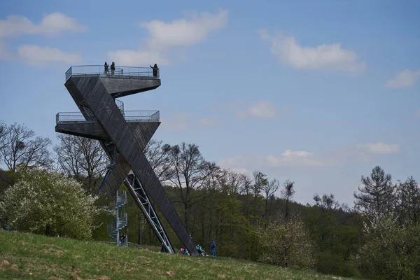  Salas, Czech Republic - April 17, 2022 - A completely unconventional tourist lookout tower above the village of Sala in the foothills of the Chriby Mountains.                                