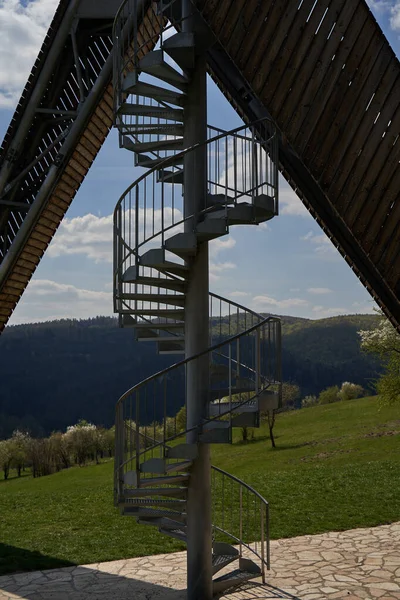 Salas, Czech Republic - April 17, 2022 - A completely unconventional tourist lookout tower above the village of Sala in the foothills of the Chriby Mountains.                                 