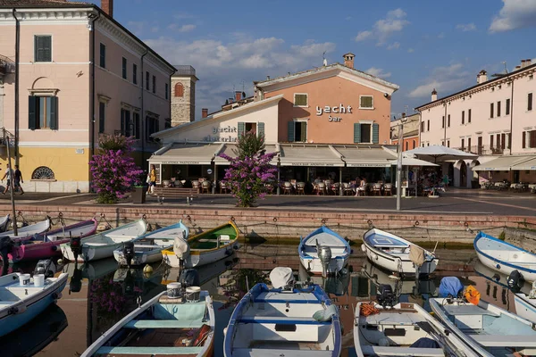 Bardolino, Italy - July 11, 2022 -  One of the biggest and most beautiful harbors on Lake Garda - Bardolino - on a summer afternoon                               