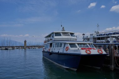 Desenzano del Garda, Italy - July 12, 2022 - yachts and boats docked at the port on Lake Garda on a sunny summer morning                               