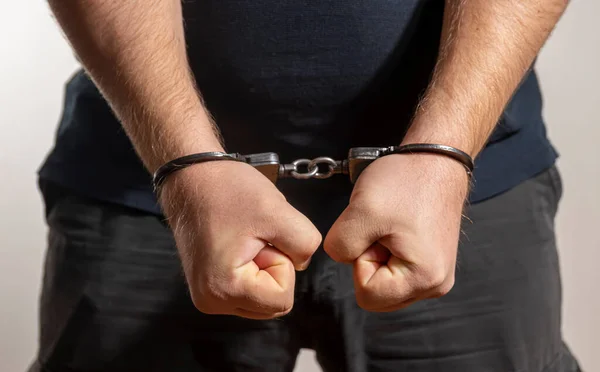 Man Handcuffed Light Background Concept Detained Criminal Illegal Migrant Police — Stock Photo, Image