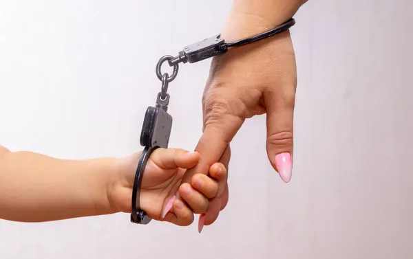 Child Hand Chained Handcuffs Holds Finger Her Mother Hand Concept — Stock Photo, Image