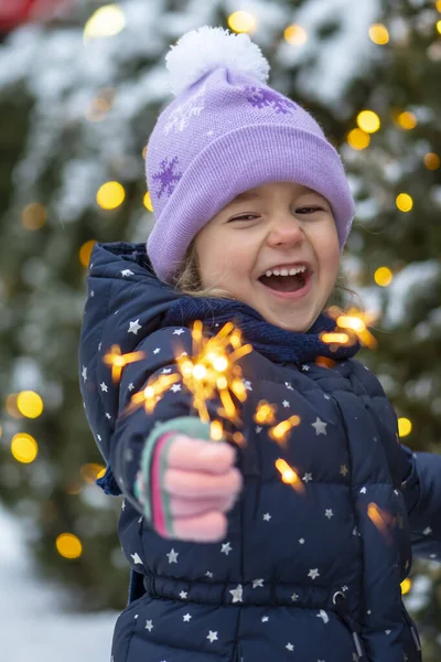 Happy Little Girl Holds Burning Sparkler Her Hand Background Christmas — Stock Photo, Image