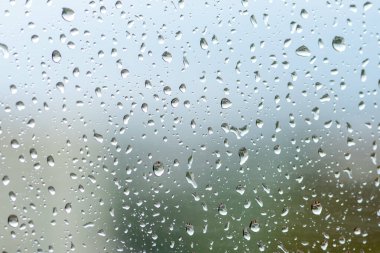 large raindrops on the window glass, rainy weather