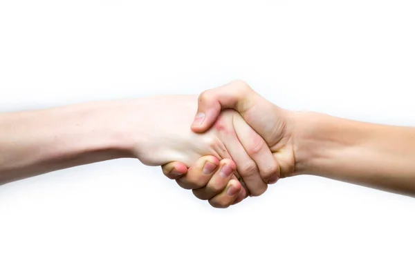 Ett handslag på en vit bakgrund, dominans av ena handen över den andra. — Stockfoto