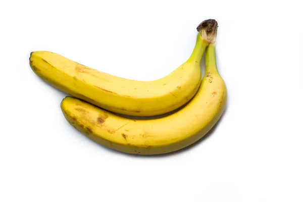 하얀 배경에 바나나 두 개가 놓여 있다. — 스톡 사진